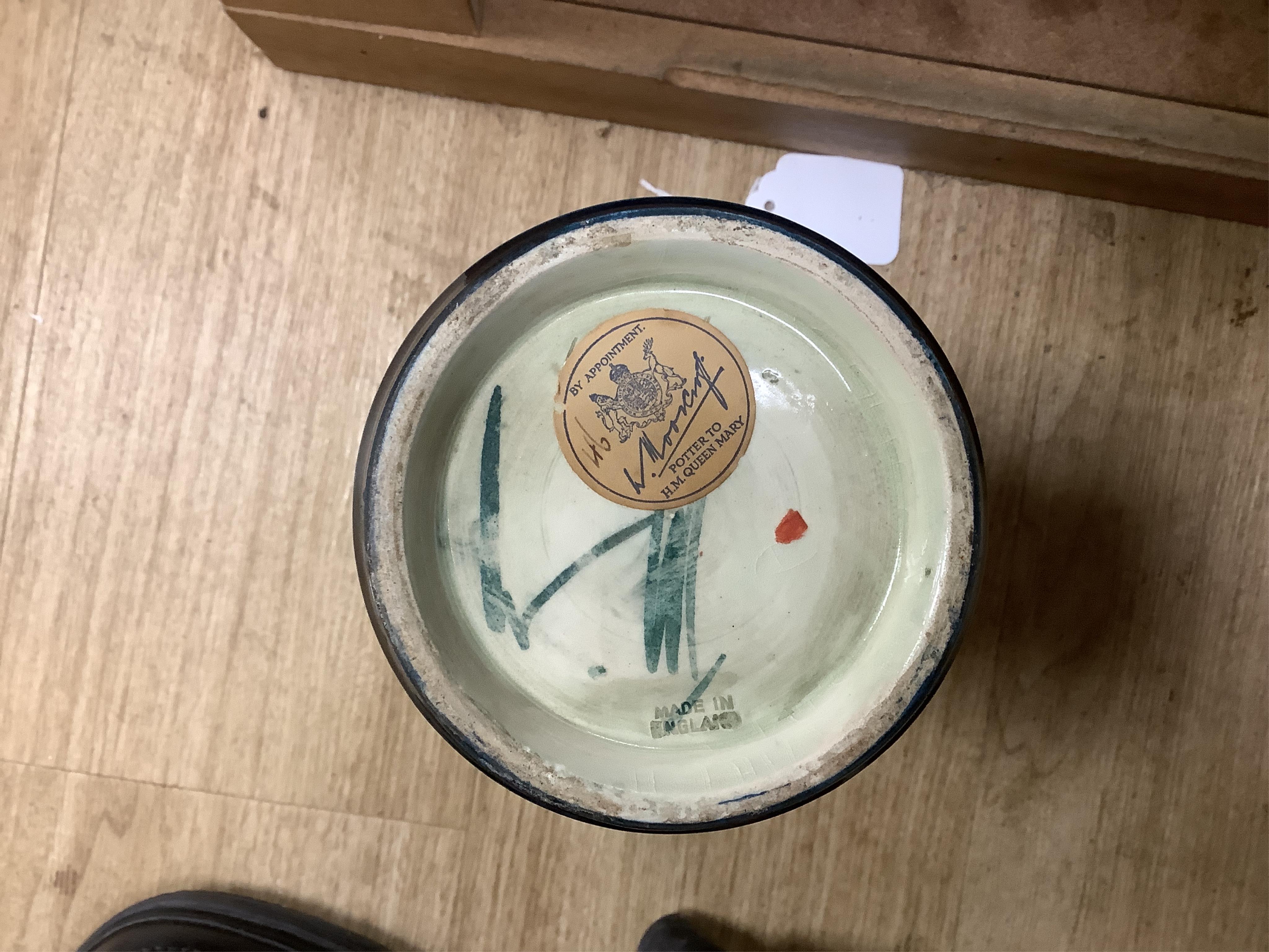 Three Moorcroft vases and a Moorcroft Hibiscus jar and cover, largest 25cm high